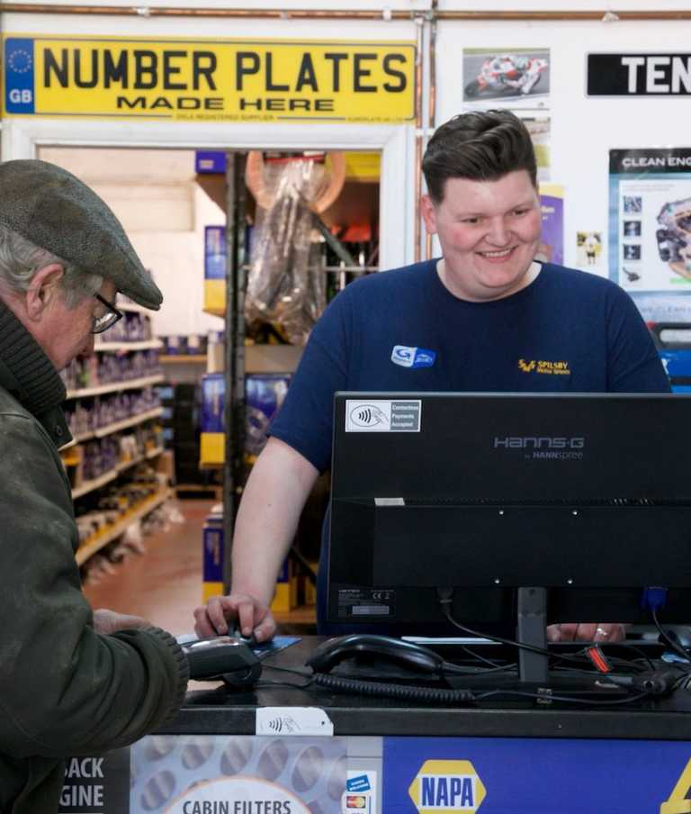 Staff member severing customer 