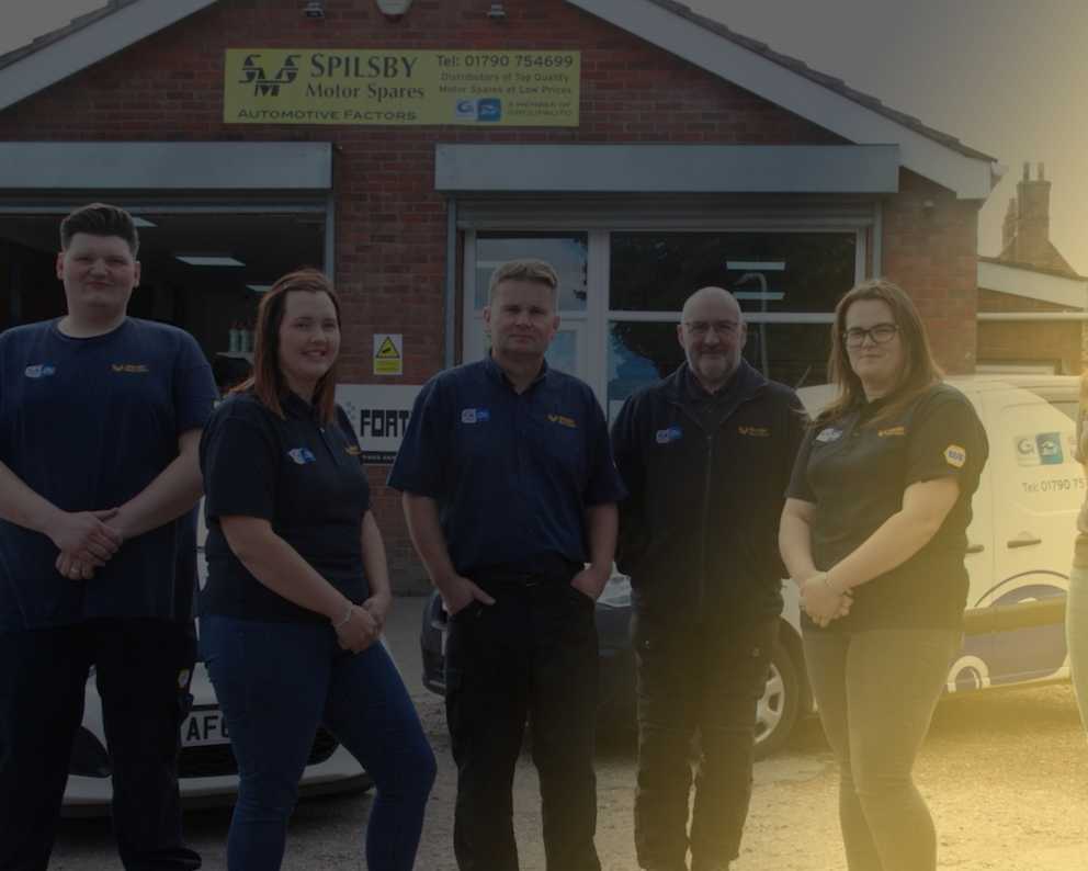 SMS team standing outside of shop